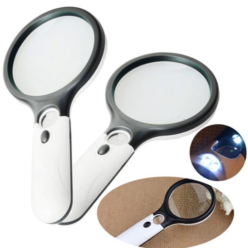 Hand Holding Magnifying Glass